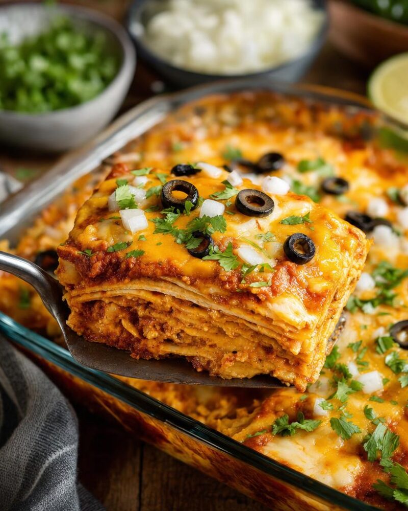 Cheese enchilada casserole layered with tortillas, cheese and red enchilada sauce
