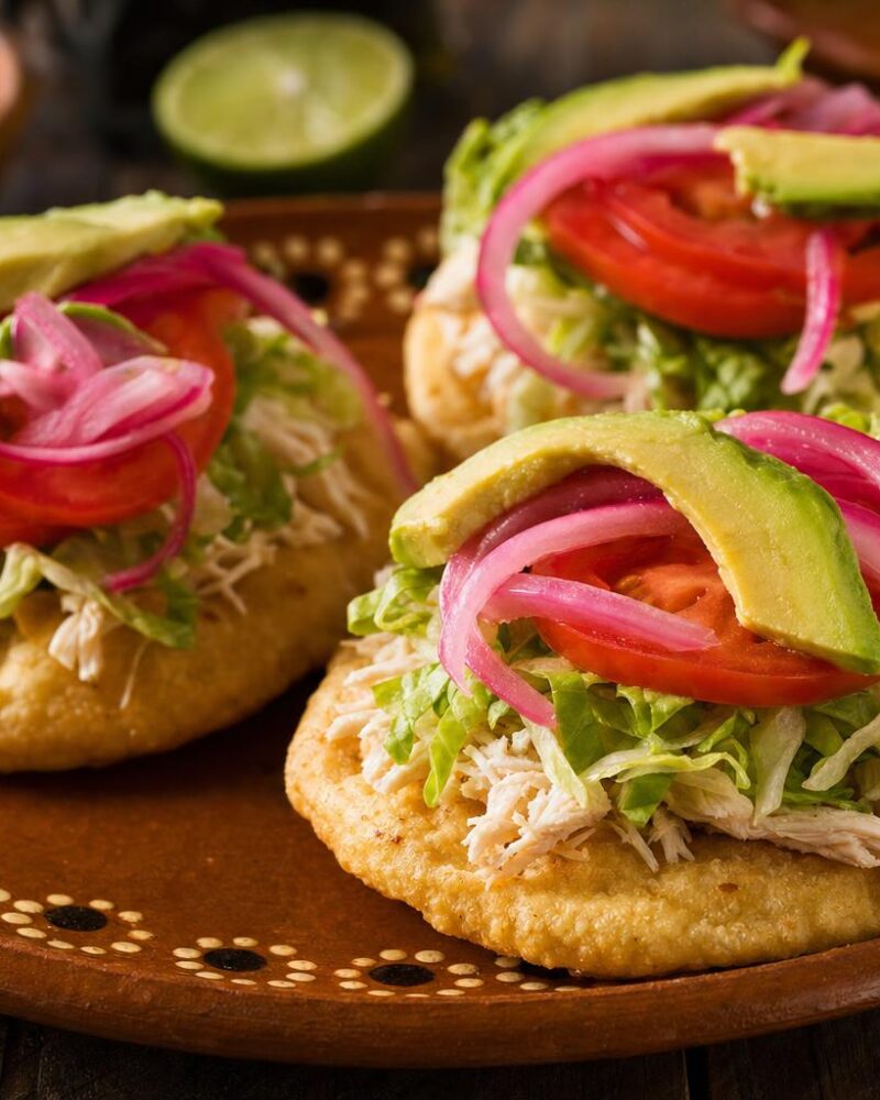 Yucatecan salbutes topped with turkey and avocado